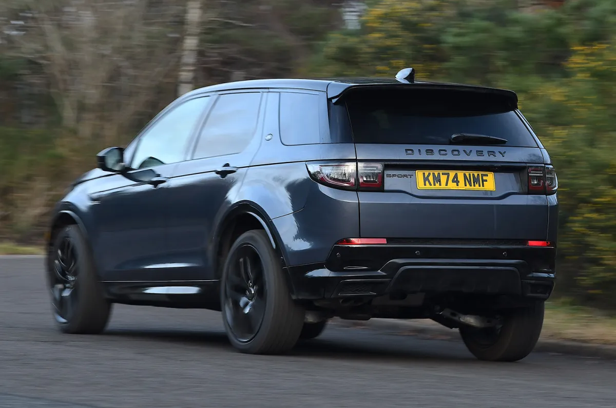 land-rover-discovery-sport-driving-rear-left.jpg