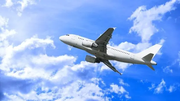 airplane-flying-among-clouds-1-620x348_11zon