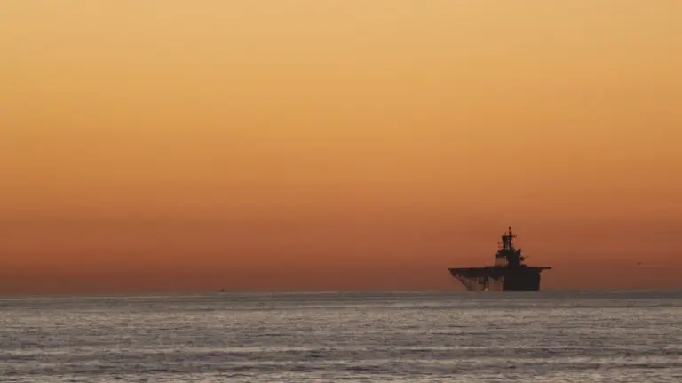 aircraft-carrier-at-sunset-1-768x431