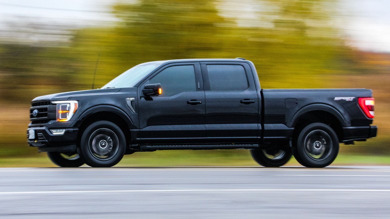 pickup-trucks-europe-popularity-1-a-black-ford-f150-on-a-road-against-blur-backgroun