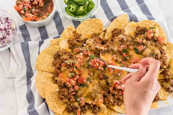 Serve-nachos-with-sour-cream
