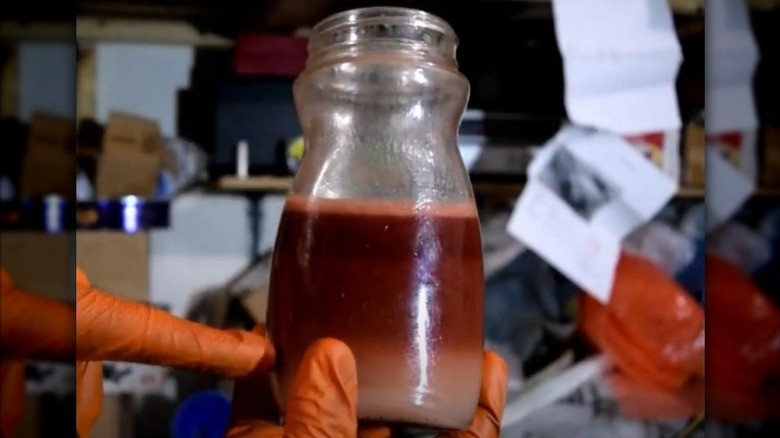 3-redish-mixture-of-water-and-transmission-fluid-in-a-container