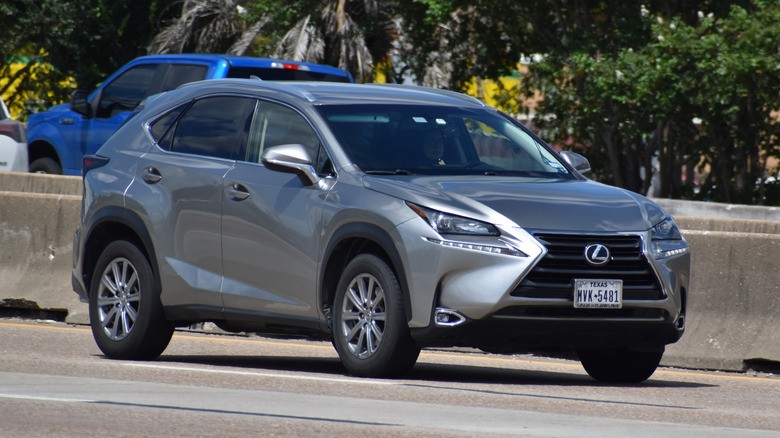 silver-lexus-nx-cruising-down-the-highway-4