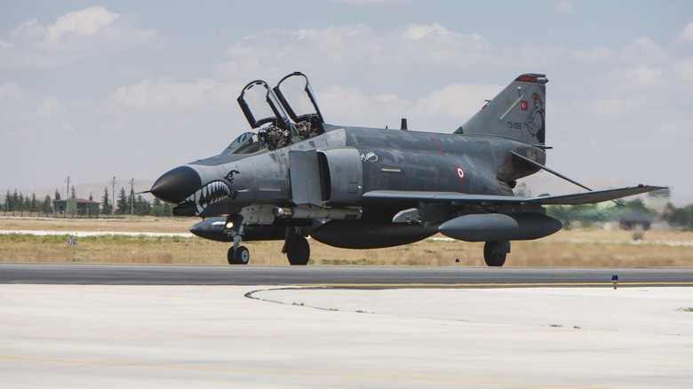 8-an-f-4-with-open-hatch-on-runway