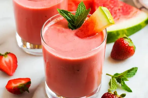 Watermelon-milkshake-with-strawberries-in-a-glass_11zon