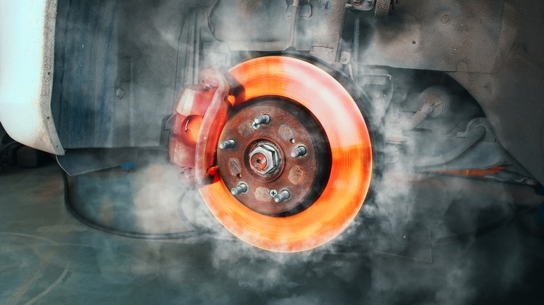 5-a-car-brake-rotor-glowing-red-hot-from-heat-with-smoke-rising-around-it