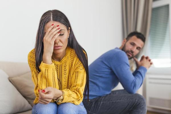 sad-pensive-young-girl-thinking-of-relationships-problems-sitting-on-sofa-with-offended-boyfriend-conflicts-in-marriage-upset-couple-after-fight-dispute-making-decision-of-breaking-up-get-divorced-photo