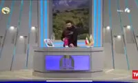 واکنش مجری به افتادن عکس حاج قاسم سلیمانی در آنتن زنده
