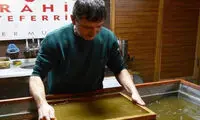 قرآنی که کاغذ آن از خاک کربلا ست!