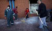 عکس: نظافت شهر آشوب‌ زده توسط سیاهان