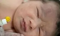 دختر نوزادی که در سرزمین مرگ‌زده نماد رویش شد