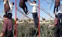 لحظه نجات یک دختر از خودکشی روی دکل برق