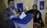 تصویر شوهر به جای کاندیدای زن در تبلیغات انتخابات عراق