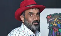امیرحسین قیاسی در کنار نصرالله رادش و همسرش