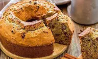 طرز تهیه کیک کشمشی گردویی؛ بدونِ فر و حرفه‌ای