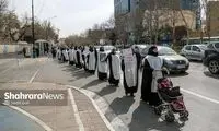 شعار زنان کفن‌پوش علیه پزشکیان و عراقچی