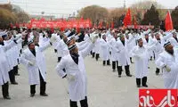 عکس: اجبار مسلمانان‌ به‌ رقص‌ در چین