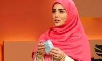 حضور مجری زن صداوسیما با اسلحه روی آنتن زنده