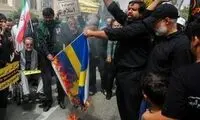 پرچم سوئد در تهران به آتش کشیده شد!