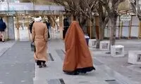 تپپ متفاوت یک روحانی و همسرش در فرودگاه 