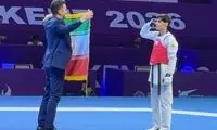 سلام نظامی پسر طلایی تکواندو به پرچم ایران