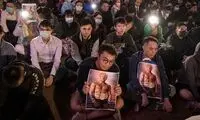 پوسترِ ترامپِ راکی در دست معترضان هنگ‌کنگی