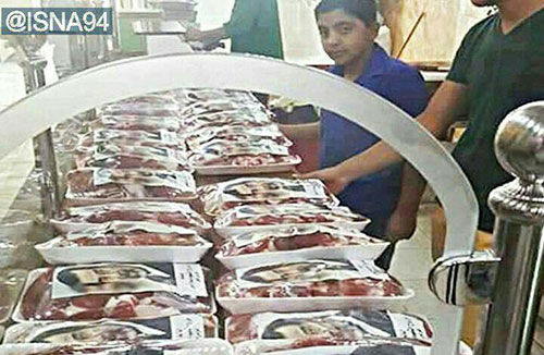 عکس: توزیع گوشت نذری با اسم صدام