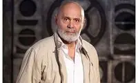 عکسی از جمشید هاشم‌پور و نوه‌اش در آغوش او
