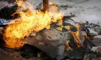 عکس کیم جونگ اون به آتش کشیده شد