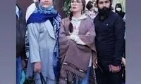 پوشش متفاوت افسانه بایگان بر سر مزار شجریان