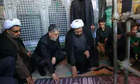 وزیر ارشاد بر سر مزار شهید حججی
