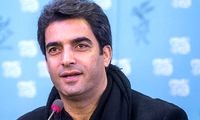 قابی از منوچهر هادی و کشتی‌گیر مشهور در تعزیه