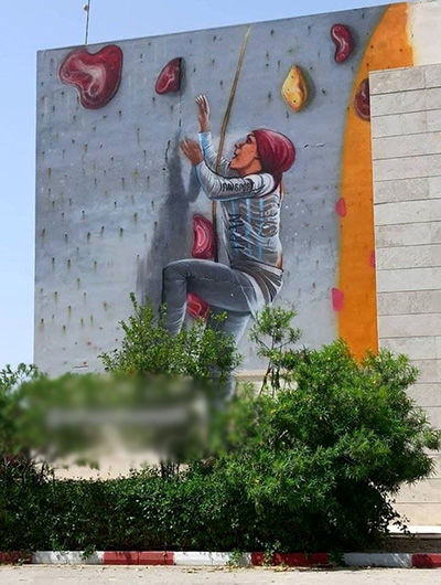 ‏نقاشی دیواری قهرمان سنگ‌نوردی ایران