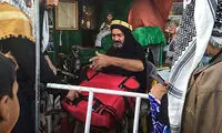 عکس: تعمیر رایگان کیف و کفش زائران کربلا