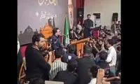 تصویر رهبر انقلاب در یک محفل قرآنی در عراق