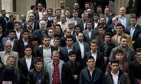 عکس: احمدی‌ نژاد در میان کشتی‌ گیران