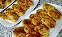 تهیه پیتزا حلزونی؛ هدیه‌ای خوشمزه برای ناهار کودکان