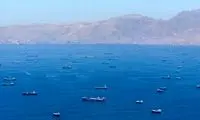 تصویر رویترز از کشتی‌های پهلو گرفته در تنگه هرمز