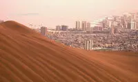 شهری در زیر سایه تپه شنی +عکس