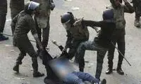 برهنه شدن زن مصری توسط پلیس + عکس