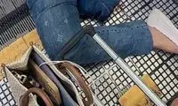 قطع پای زنی که در پیاده‌روی متحرک گیر کرد