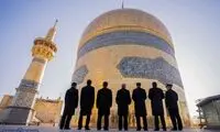 تصاویری از مراسم تعویض پرچم گنبد حرم رضوی